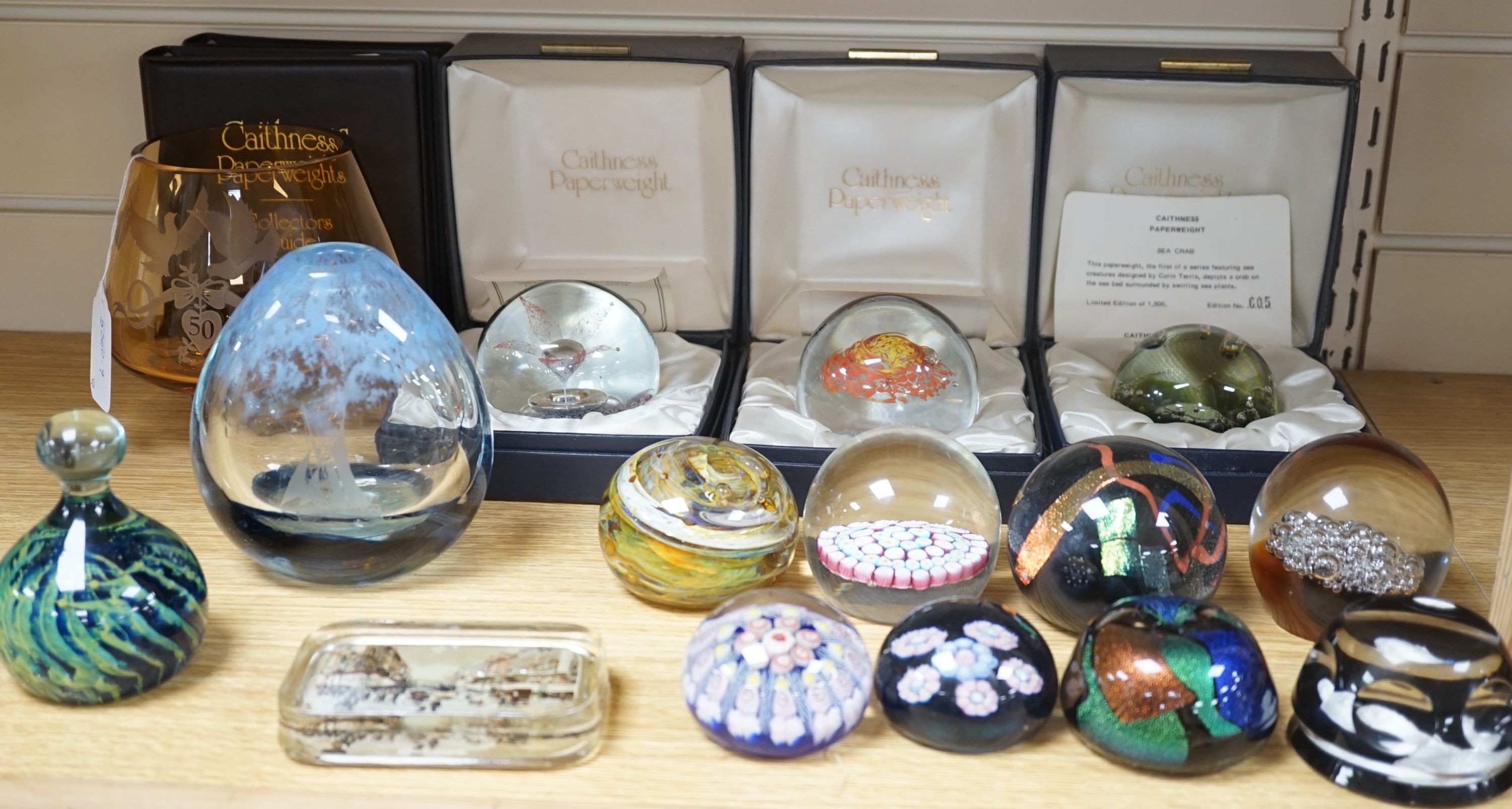 2 Caithness glass vases together with 11 various paperweights, including 3 boxed Caithness and a Baccarat paperweight.